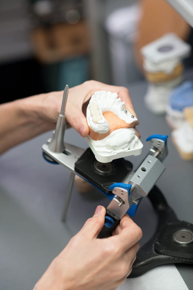 dental-prosthesis-prosthetist-working-with-equipment-dental-clinic (1)